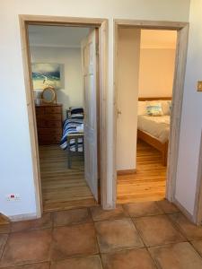 a room with a door open to a bedroom at Sea Breeze in Poole +10 photos
