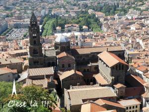 an aerial view of a city with a church at Studio indépendant contre la Cathedrale - ancien couvent - 4eme etage sans ascenseur in Le Puy-en-Velay +2 photos