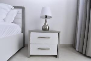 Ένα ή περισσότερα κρεβάτια σε δωμάτιο στο kacyiru greeny apartments