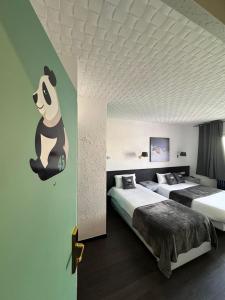 Voodi või voodid majutusasutuse Hotel Panda toas