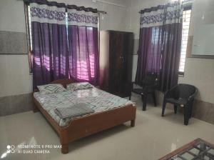 Voodi või voodid majutusasutuse Swanand Home Stay toas