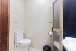 a small bathroom with a toilet and a sink at Sweet Home Salga in Salga +32 photos