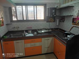 Köök või kööginurk majutusasutuses Swanand Home Stay