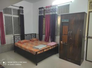 Voodi või voodid majutusasutuse Swanand Home Stay toas