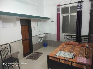 Voodi või voodid majutusasutuse Swanand Home Stay toas