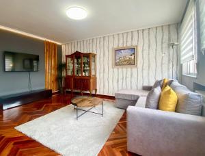 a living room with a couch and a table at Loft Lugo Centro in Lugo