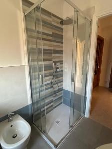 a shower in a bathroom with a toilet and a sink at Relax al mare in Borgio Verezzi +21 photos