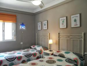 Ένα ή περισσότερα κρεβάτια σε δωμάτιο στο Comfortable Apartment Ayamonte Garden