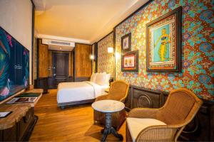 Voodi või voodid majutusasutuse The Orient Jakarta, a Royal Hideaway Hotel toas