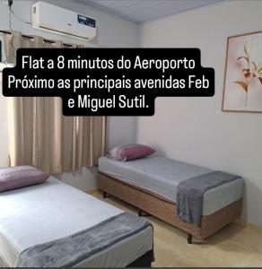 Ένα ή περισσότερα κρεβάτια σε δωμάτιο στο Flat da Vila