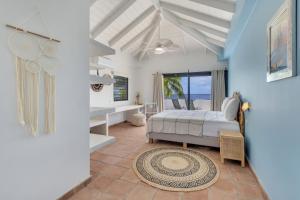 Ένα ή περισσότερα κρεβάτια σε δωμάτιο στο Oceanfront Villa Mingo Bonaire +35 φωτογραφίες