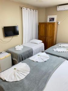 Postel nebo postele na pokoji v ubytování Pousada da Orla