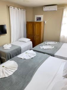 Postel nebo postele na pokoji v ubytování Pousada da Orla