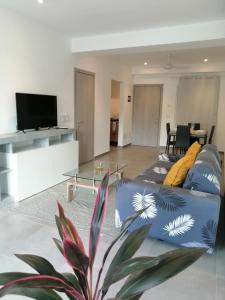 a living room with a couch and a table at Sabrina Plaza Residence in Las Terrenas