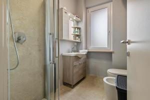 a bathroom with a shower and a sink at My town home apartment in Torri del Benaco
