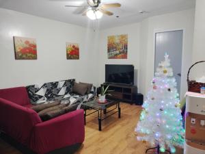 a living room with a christmas tree in it at 3BR Davao Condo 7thfloor near Airport in Pagamikan