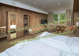 Postel nebo postele na pokoji v ubytování Hotel Tři Růže