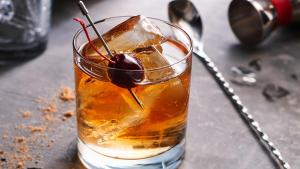 a drink with a cherry on a table at Courtyard by Marriott Charlotte Gastonia in Gastonia