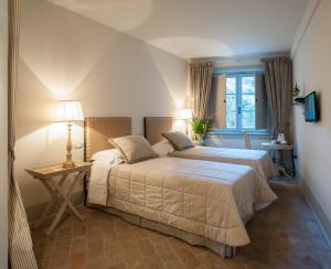 A bed or beds in a room at B&B Pieve Degli Artisti
