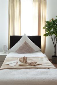 Ένα ή περισσότερα κρεβάτια σε δωμάτιο στο Lemsdorfer Apartments Magdeburg