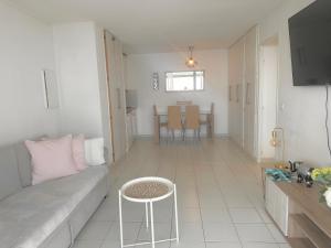 a living room with a couch and a table at SARA RIVIERA Costa Plana in Cap d'Ail