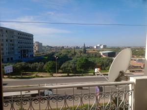 a satellite dish sitting on the ledge of a balcony at Sousse appartement sahloul in Sousse