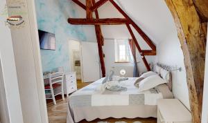 Postel nebo postele na pokoji v ubytování Chambre double Paradis