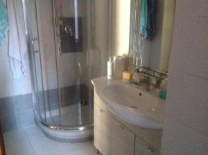 a bathroom with a shower and a sink at La casina di Silverio in Rio Marina +9 photos