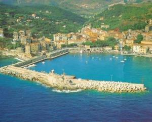 a large body of water with a town in the background at La casina di Silverio in Rio Marina