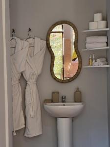 a bathroom with a mirror and a sink at Ourika Valley Haven - Breathe, Relax, Unwind in Ourika +23 photos