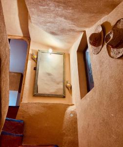 an overhead view of a mirror in a room with a window at Chez lameene in Tahannout +9 photos