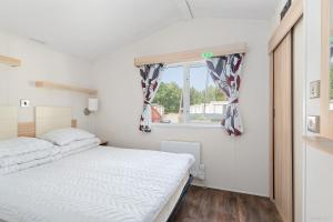 Postel nebo postele na pokoji v ubytování First Camp Lilleby