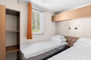 Postel nebo postele na pokoji v ubytování First Camp Lilleby