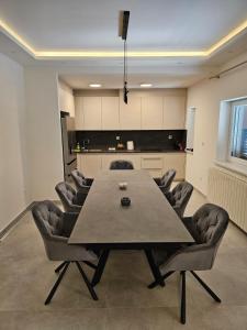 a conference room with a large table and chairs at Villa Ante in Šestanovac