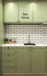 Kuchyň nebo kuchyňský kout v ubytování SEA HOME Accommodation