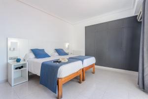 Postel nebo postele na pokoji v ubytování Hotel Vibra Vila