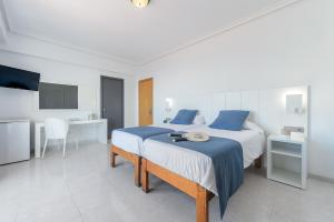 Postel nebo postele na pokoji v ubytování Hotel Vibra Vila