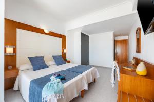 Postel nebo postele na pokoji v ubytování Hotel Vibra Vila