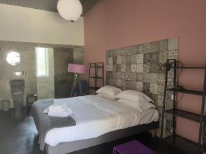 Postel nebo postele na pokoji v ubytování Hôtel Ascosa Aventure