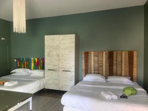 Postel nebo postele na pokoji v ubytování Hôtel Ascosa Aventure