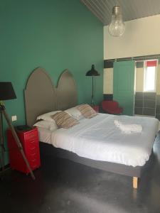 Postel nebo postele na pokoji v ubytování Hôtel Ascosa Aventure