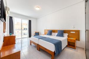 Postel nebo postele na pokoji v ubytování Hotel Vibra Vila