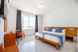 Postel nebo postele na pokoji v ubytování Hotel Vibra Vila