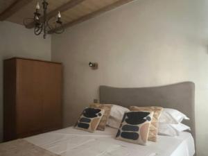 En eller flere senge i et værelse på Appartement prestige, cour Paoli