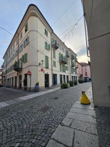 a yellow cone sitting on a street next to a building at Ca' Tecla in Asti