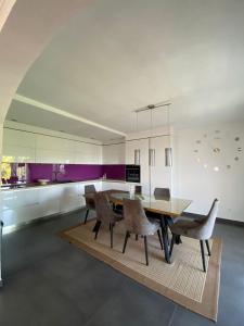 a dining room with a wooden table and chairs at Apartments by the sea Sucuraj, Hvar - 578 in Sućuraj