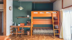 Ein Bett oder Betten in einem Zimmer der Unterkunft 一棟貸切の和風プライベートヴィラ プール花火バーベキュー