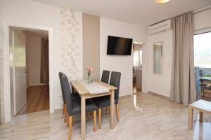 TV a/nebo společenská místnost v ubytování Sunshine Residence Baska