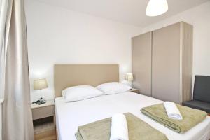 Postel nebo postele na pokoji v ubytování Sunshine Residence Baska