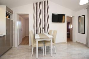 TV a/nebo společenská místnost v ubytování Sunshine Residence Baska